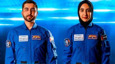 Undated handout photograph from the state-run WAM news agency showing Emirati astronauts Mohammed al-Mulla, left, and Noura al-Matroushi.