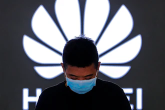 Employee inside a Huawei store in Beijing, Aug. 31, 2020.