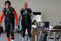 French pilot Vincent Reffet, left, and his mentor Yves Rossy prepare for a fly in Dubai, May 12, 2015.