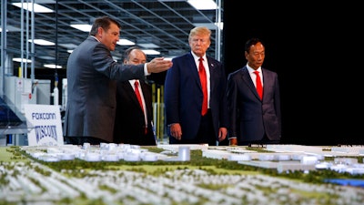 President Donald Trump, Foxconn chairman Terry Gou, right, and CEO of SoftBank Masayoshi Son in Mt. Pleasant, Wis., June 28, 2018.