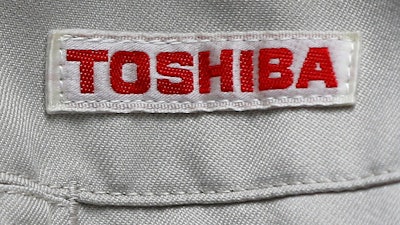 Toshiba Corp. logo on a worker's jacket, Yokosuka, Japan, June 15, 2017.