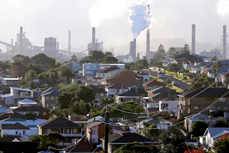 Chimneys at a steel factory in Port Kembla, Australia, July 2, 2014.