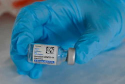 U.S. Army medic Kristen Rogers, of Waxhaw, N.C., holds a vial of the Johnson & Johnson COVID-19 vaccine in North Miami, Fla., March 3, 2021.