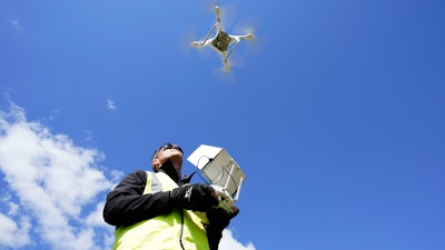 Michael Jones operates his drone in Goldsboro, N.C., April 2, 2021.