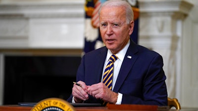 President Joe Biden pauses after signing an executive order relating to U.S. supply chains, State Dining Room, White House, Feb. 24, 2021.