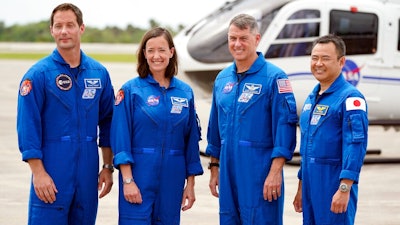 SpaceX Crew 2 members, from left, European Space Agency astronaut Thomas Pesquet, NASA astronauts Megan McArthur and Shane Kimbrough and Japan Aerospace Exploration Agency astronaut Akihiko Hoshide gather at the Kennedy Space Center in Cape Canaveral, Fla., Friday, April 16, 2021 to prepare for a mission to the International Space Station. The launch is targeted for April 22.