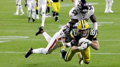 The Green Bay Packers' Robert Tonyan scores a touchdown in a game against the Atlanta Falcons, Oct. 5, 2020, Green Bay, Wis.