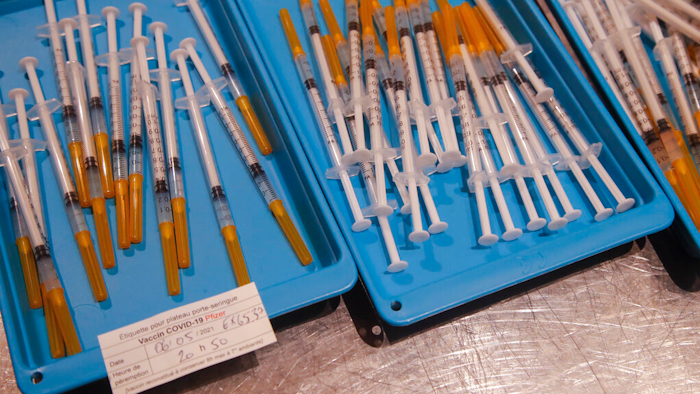 Syringes with the Pfizer COVID-19 vaccine at a vaccination center in Paris, May 6, 2021.
