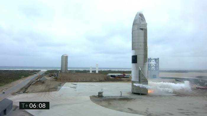 In this image from video made available by SpaceX, a Starship test vehicle sits on the ground after returning from a flight test in Boca Chica, Texas on Wednesday, May 5, 2021
