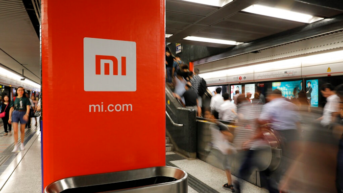 In this July 9, 2018, file photo, an advertisement for Xiaomi is displayed at a subway station in Hong Kong. China’s commerce ministry said Thursday that the removal of Xiaomi Corp. from a U.S. government blacklist was beneficial, a day after the U.S. reversed a ban on U.S. investments in the smartphone maker imposed by former President Donald Trump.