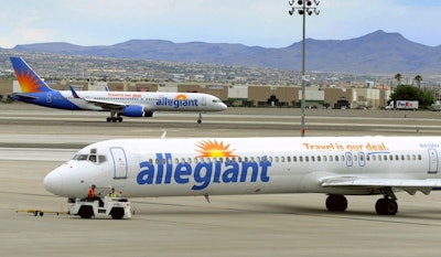 Allegiant Air jets taxi at McCarran International Airport in Las Vegas, May 9, 2013.