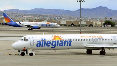 Allegiant Air jets taxi at McCarran International Airport in Las Vegas, May 9, 2013.