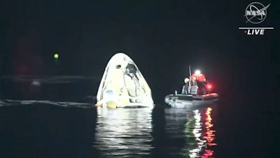 SpaceX Dragon capsule floats after landing in the Gulf of Mexico near the Florida Panhandle, May 2, 2021.