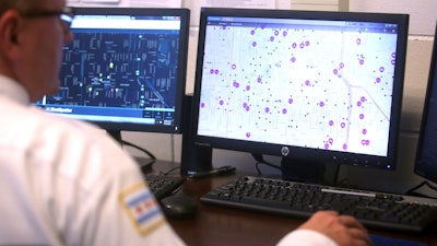 Officers monitor ShotSpotter and other crime detection programs at the Chicago Police Department 7th District's Strategic Decision Support Center, May 22, 2017.