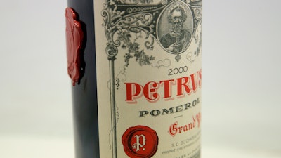 A bottle of Petrus red wine that spent a year orbiting the world in the International Space Station pictured in Paris, May 3, 2021.