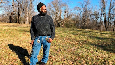Clyde Robinson, 80, speaks with a reporter while standing on his land, Memphis, Jan. 28, 2021.