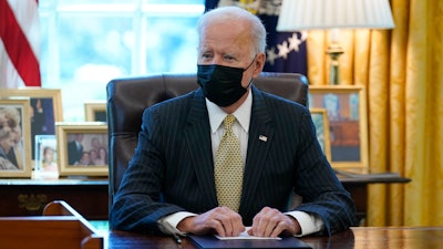 President Joe Biden speaks after signing the PPP Extension Act of 2021 in the Oval Office, March 30, 2021.