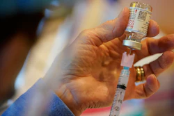 In this Dec. 29, 2020, file photo, Pat Moore, with the Chester County, Pa., Health Department, fills a syringe with Moderna COVID-19 vaccine before administering it to emergency medical workers and health care personnel at the Chester County Government Services Center in West Chester, Pa. The Biden administration’s call to lift patent protections on COVID-19 vaccines to help poor parts of the world get more doses has drawn praise from some countries and health advocates. But it has run into resistance from the pharmaceutical industry and others, who say that it won’t help curb the outbreak any time soon and will hurt future innovation.