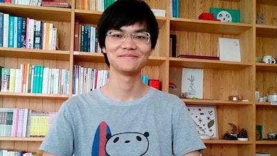 In this photo released by his friend, Cai Wei poses in Beijing, June 2018.