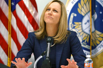 Consumer Financial Protection Bureau Director Kathy Kraninger speaks to media at the CFPB offices in Washington, Dec. 11, 2018.