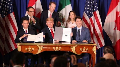 Mexican President Enrique Pena Nieto, U.S. President Donald Trump and Canadian Prime Minister Justin Trudeau after signing the United States-Mexico-Canada Agreement, Buenos Aires, Nov. 30, 2018.