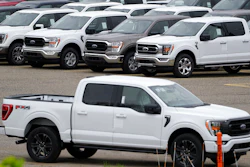 Ford pickup trucks built lacking computer chips are shown in parking lot storage in Dearborn, Mich., May 4, 2021.