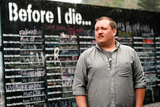 Nate Mullins, a former bartender, near a street mural in Mount Vernon, Wash., May 17, 2021.