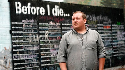 Nate Mullins, a former bartender, near a street mural in Mount Vernon, Wash., May 17, 2021.