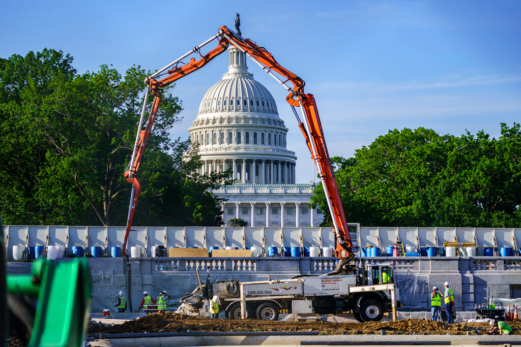 A concrete pump frames the Capitol Dome during renovations and repairs to Lower Senate Park on Capitol Hill in Washington on May 18.