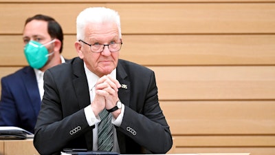 Winfried Kretschmann, the governor of German federal state Baden-Wuerttemberg, attends a session of the state parliament in Stuttgart, May 19, 2021.