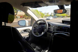 A Waymo minivan moves along a city street during an autonomous vehicle ride, April 7, 2021, Chandler, Ariz.