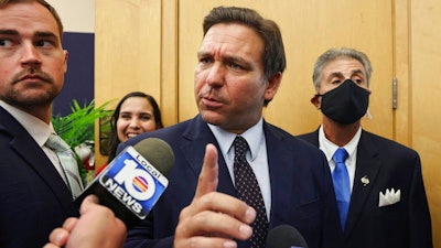 Florida Gov. Ron DeSantis responds to local TV reporter's question, MARC building, Florida International University, Miami, May 24, 2021.