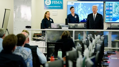 President Joe Biden talks to employees at FEMA headquarters, Washington, May 24, 2021.