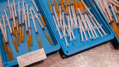 Syringes with the Pfizer COVID-19 vaccine at a vaccination center in Paris, May 6, 2021.