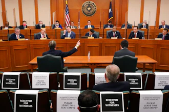 Curtis Morgan, CEO of Vistra Corp., at table left, testifies at a joint Committees on State Affairs and Energy Resources hearing, Austin, Texas, Feb. 25, 2021.