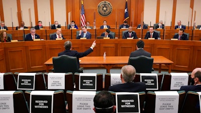 Curtis Morgan, CEO of Vistra Corp., at table left, testifies at a joint Committees on State Affairs and Energy Resources hearing, Austin, Texas, Feb. 25, 2021.