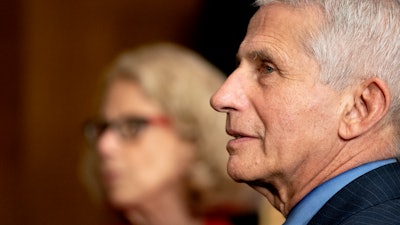 Dr. Anthony Fauci, director of the National Institute of Allergy and Infectious Diseases, and Diana Bianchi, director of the Eunice Kennedy Shriver National Institute of Child Health and Human Development, speak after a Senate Appropriations Subcommittee hearing on Capitol Hill, May 26, 2021.