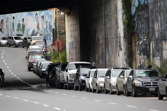 Vehicles line up near a gas station to fill their tanks in Caracas, Venezuela, Sept 8, 2020.
