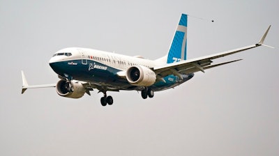 A Boeing 737 Max jet prepares to land at Boeing Field, Seattle, Sept. 30, 2020.