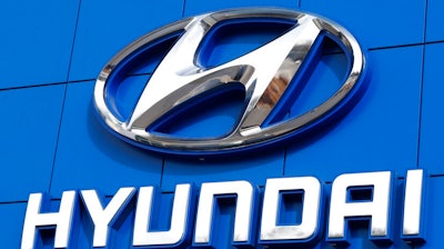 This July 26 2018 file photo shows the logo of Hyundai Motor Co. in Seoul, South Korea. Hyundai is recalling over 390,000 vehicles in the U.S. and Canada, Tuesday, May 4, 2021, for problems that can cause engine fires. In one recall, owners are being told to park outdoors until repairs are made. That recall covers more than 203,000 Santa Fe Sport SUVs from 2013 through 2015.