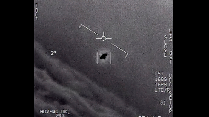 Image from a 2015 video, labelled Gimbal, shows an unexplained object tracked as it soars high along the clouds, traveling against the wind.