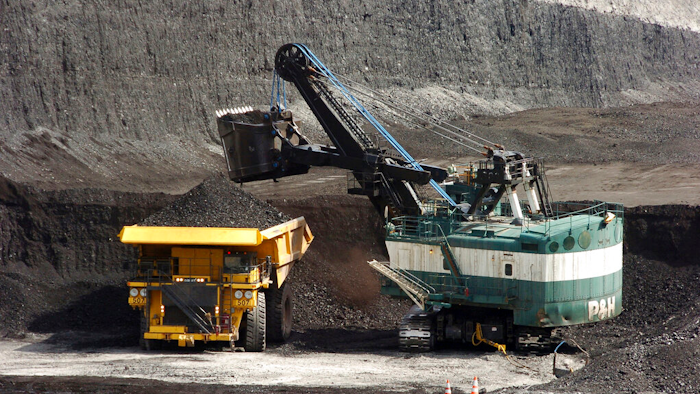 A mechanized shovel loads a haul truck at the Spring Creek coal mine near Decker, Mont., April 4, 2013.