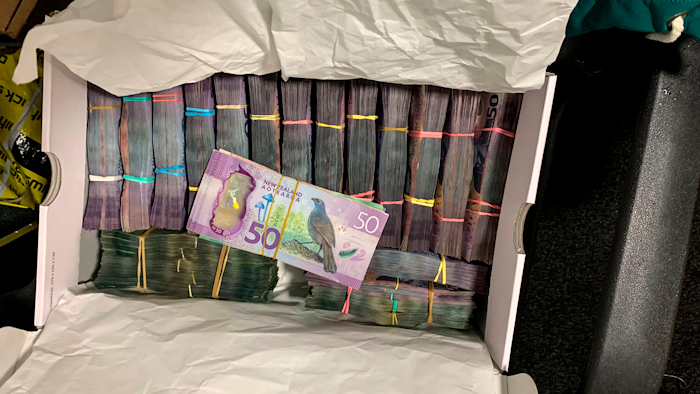 A box containing a large amount of cash was discovered during a police raid as part of Operation Trojan.