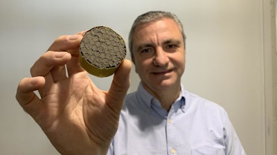 Professor Michele Meo with lightweight aerogel suspended in a honeycomb structure.