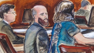 Courtroom sketch of Joshua Schulte, center, with his attorneys during jury deliberations in New York, March 4, 2020.