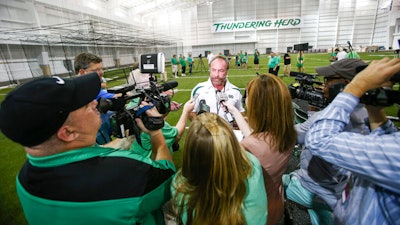 Chris Cline speaks with media as Marshall University dedicates the Chris Cline Athletic Complex, Huntington, W.Va., Sept. 6, 2014.