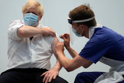British Prime Minister Boris Johnson receives his second jab of the AstraZeneca coronavirus vaccine at the Francis Crick Institute in London, June 3, 2021.