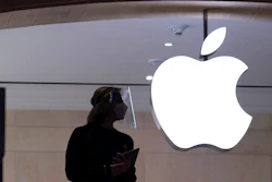 Apple store employee in New York, Feb. 5, 2021.