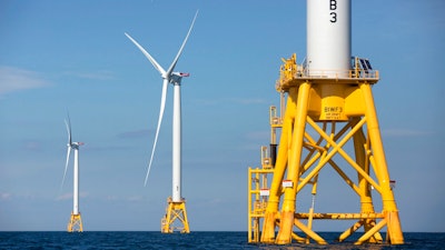 Three wind turbines in the water off Block Island, R.I., Aug. 15, 2016.