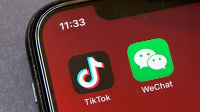 TikTok and WeChat icons on a smartphone screen in Beijing, Aug. 7, 2020.